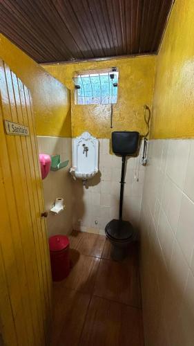 a small bathroom with a toilet and a window at Cop30 in Belém
