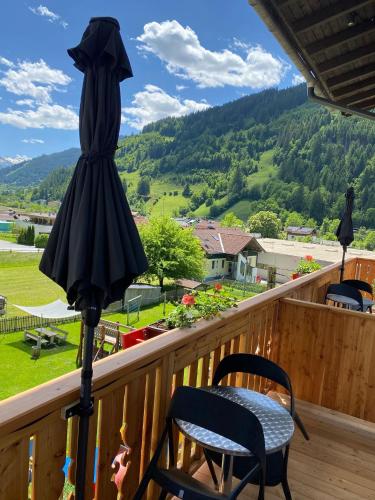 a dress hanging on a pole on a balcony at Landhotel Steindlwirt in Dorfgastein