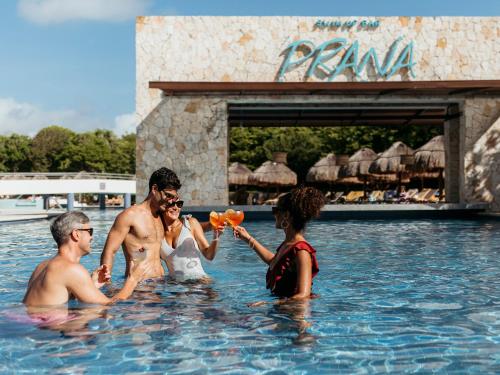a group of people in the water at a resort at Grand Sirenis Riviera Maya Resort & Spa All Inclusive in Akumal