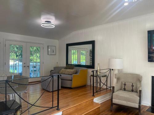 a living room with a couch and a chair at Entire 5 Bedrooms Home near DC and Metro in Silver Spring