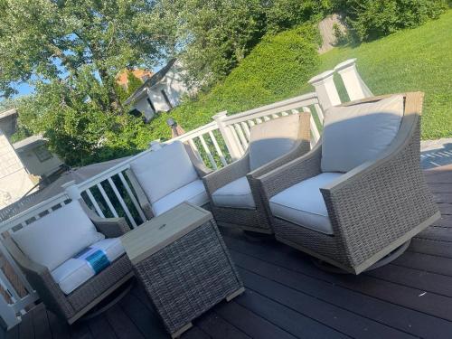 a group of chairs and a table on a deck at Entire 5 Bedrooms Home near DC and Metro in Silver Spring
