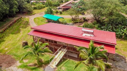 an aerial view of a house with a red roof at Hotel del Bosque in Río Cuarto