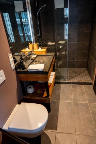 a bathroom with a sink and a shower at Restaurant Hotel Zum Storchen in Waldkirch