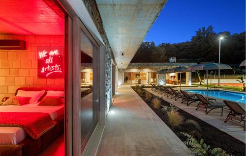 a hotel with a sign that says we are all night at Beautiful Home In Dicmo in Dicmo