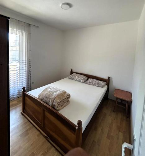 Ένα ή περισσότερα κρεβάτια σε δωμάτιο στο Tivat Apartmani