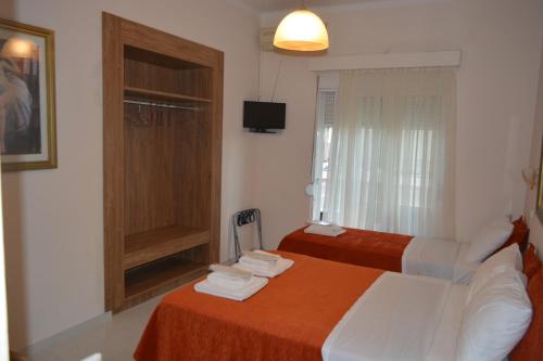 Ένα ή περισσότερα κρεβάτια σε δωμάτιο στο Hotel Lefka Ori - City Rooms