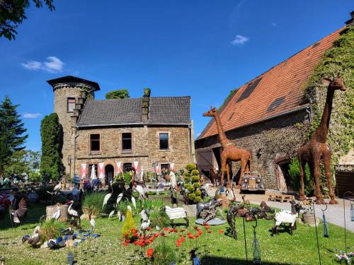 a display of statues of giraffes in front of a house at Ferienwohnung Muttental in Witten