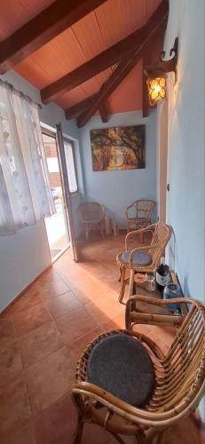 a living room with chairs and a table at App Mariuccia in Umag