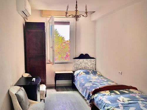 a bedroom with a bed and a window at L'ENCANTO DE LUNA -Una Casa Autentica Comacchiese in Comacchio