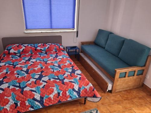 Ένα ή περισσότερα κρεβάτια σε δωμάτιο στο Apartamento das escadinhas T0