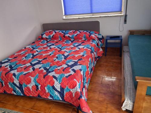 Ένα ή περισσότερα κρεβάτια σε δωμάτιο στο Apartamento das escadinhas T0