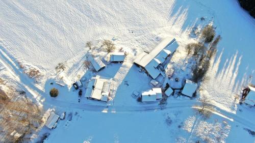an aerial view of a house in the snow at Hagen Familje Farm in Årjäng