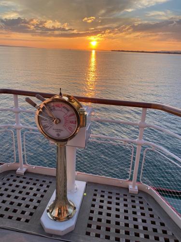 a clock sitting on the deck of a cruise ship at Ferienwohnung Mario am Bodensee in Höchst