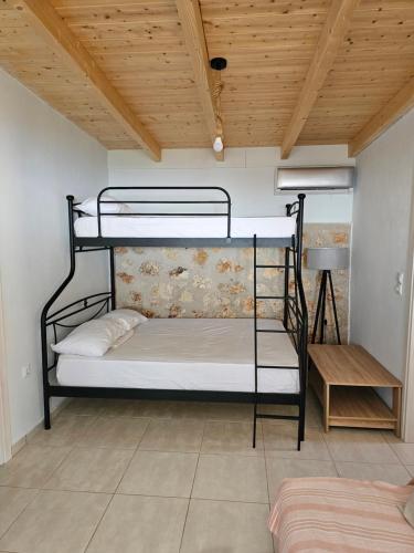 Ένα ή περισσότερα κρεβάτια σε δωμάτιο στο Villa Ventus