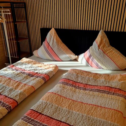 two beds with pillows on top of each other at Ferienwohnung Viona in Neustrelitz