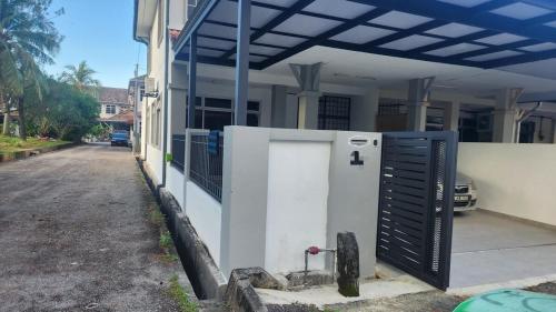 a building with a gate in front of a house at 2627 Home at SP North in Bedung