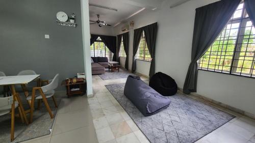 a living room with a purple pillow on the floor at 2627 Home at SP North in Bedung