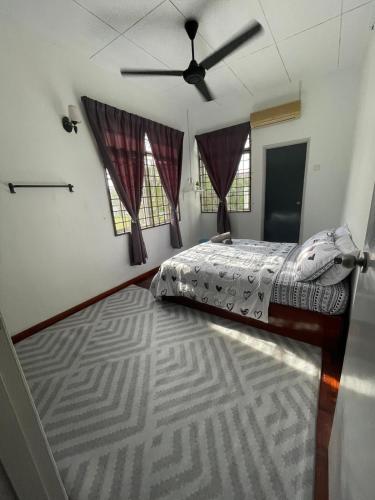 a bedroom with a bed and a ceiling fan at 2627 Home at SP North in Bedung