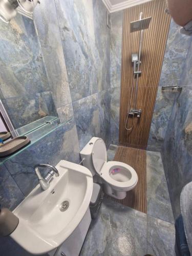 a bathroom with a white toilet and a sink at Mihalkat Old Town in Sozopol