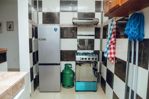 Η κουζίνα ή μικρή κουζίνα στο Studio Okala M Appartement meublé proche aéroport Libreville