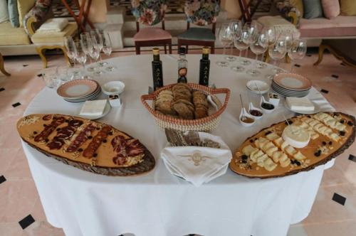 a table with three baskets of food on it at Sintra Marmòris Camélia in Sintra