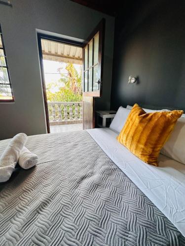 a large bed with two pillows on top of it at Aruwaa in East London