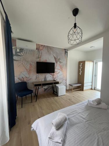 a bedroom with a bed and a desk with a piano at Maison 25 in 2 Mai
