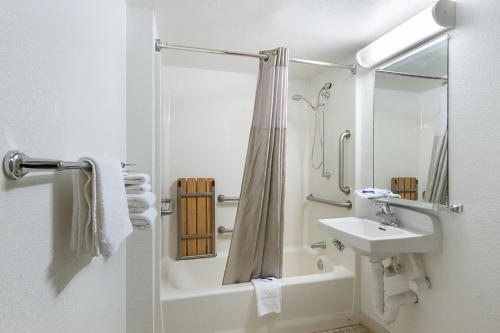 a white bathroom with a sink and a shower at Motel 6-Mesa, AZ - South in Mesa