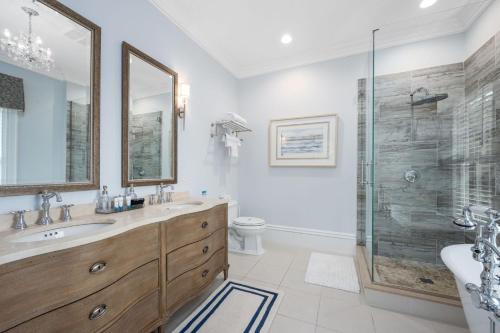 a bathroom with a sink and a shower at 525 Route 28 Harwich Port Cape Cod - - The Mooring in Harwich Port