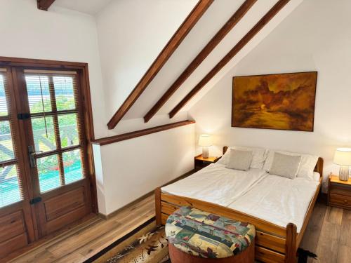 En eller flere senge i et værelse på Letnisko Zielony Zakątek