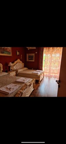 a bedroom with two beds and a window at Nano Bio Farm in Tirana