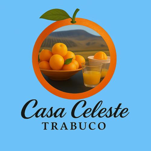 a picture of a bowl of oranges and a glass of orange juice at Casa Celeste Trabuco in Villanueva del Trabuco