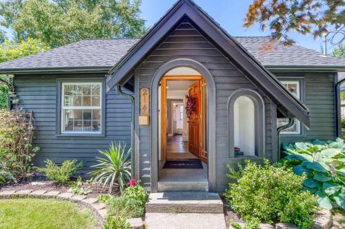 a blue house with an orange door at Modern 2 Bedroom Farmhouse Cottage with Hot Tub in Snohomish in Snohomish