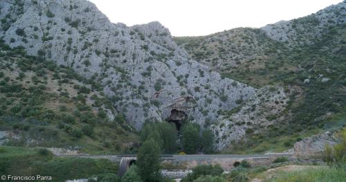 a mountain with a road in front of it at Casa Rural El Nacimiento in Benaoján