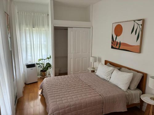 a bedroom with a large bed in a room at Sunny Private Room in Bed-Stuy in Brooklyn