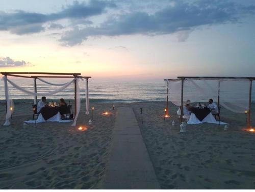 a wedding ceremony on the beach at sunset at Casa Vacanze Mare Gargano Puglia Marina Di Lesina - 4g min in Lesina
