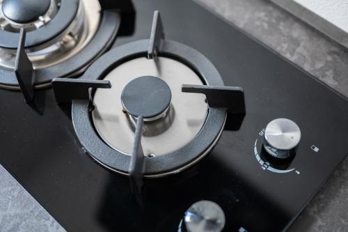 a close up of a stove top with a burner at Domus Juvenilia in Noto