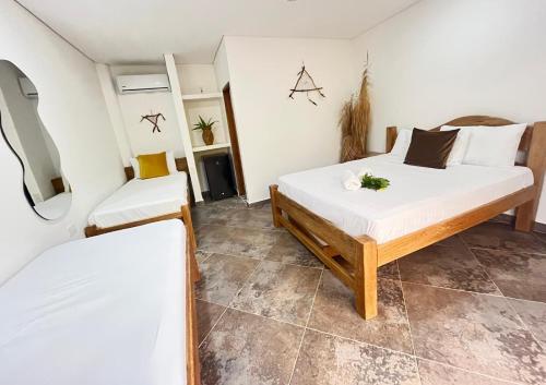 Postel nebo postele na pokoji v ubytování Hotel Heliopolis