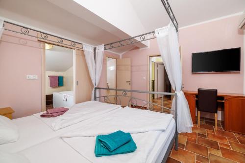 Postel nebo postele na pokoji v ubytování House Davorka