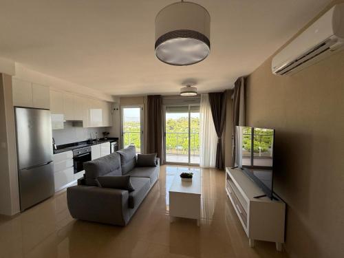 a living room with a couch and a table at MAGIC WORLD Vacaciones in Castellón de la Plana