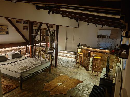 a bedroom with a bed and a fireplace at Airport Apartment AIR 2 in Surčin