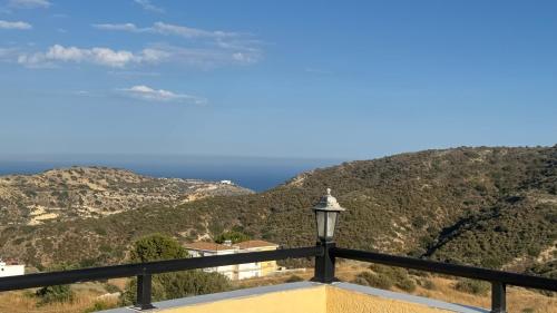a view of the ocean from the balcony of a house at Olympus Holiday villa in Pissouri