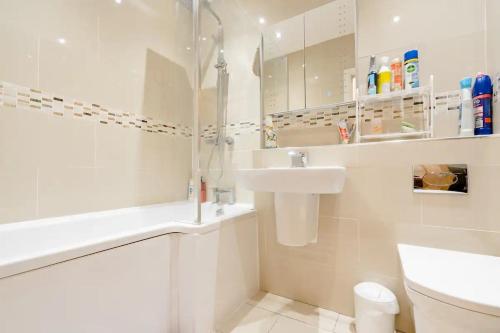 a white bathroom with a sink and a toilet at Quiet Private Homestay, Central Birmingham in Birmingham