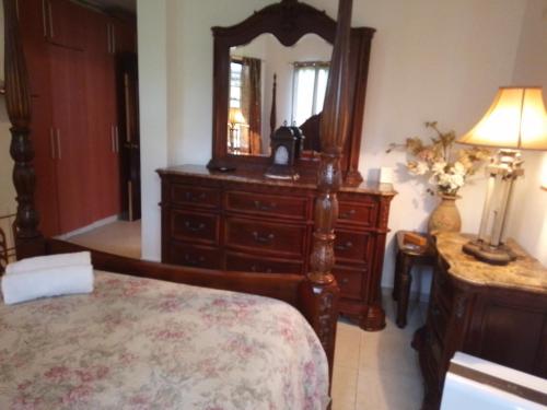 a bedroom with a dresser and a mirror at Luxury apartmеnt with private terrace in Altos del Maria in Sorá