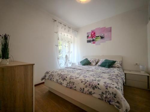 a bedroom with a bed and a window at LUNA APARTMENTS Quiet Retreat, Close to Koper, AirCon, Parking in Ankaran