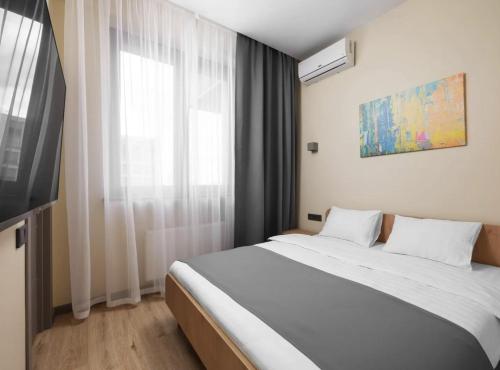 Ένα ή περισσότερα κρεβάτια σε δωμάτιο στο Твій Простір Nestro