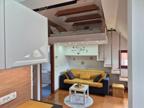 a living room with a couch and a table at Juliana Apartment Bohinj Lake in Bohinj