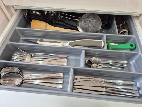 a drawer full of utensils in a drawer at Juliana Apartment Bohinj Lake in Bohinj