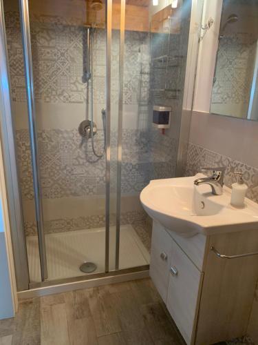 a bathroom with a shower and a sink at U muragliuni 1 in Lascari