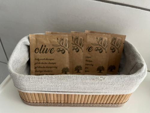a basket with three boxes in it on a table at Résidence d'Angelo in Huy